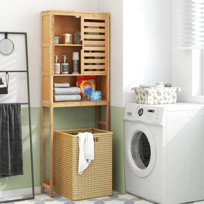 Freestanding tall bamboo bathroom shelf with two doors and open storage above toilet